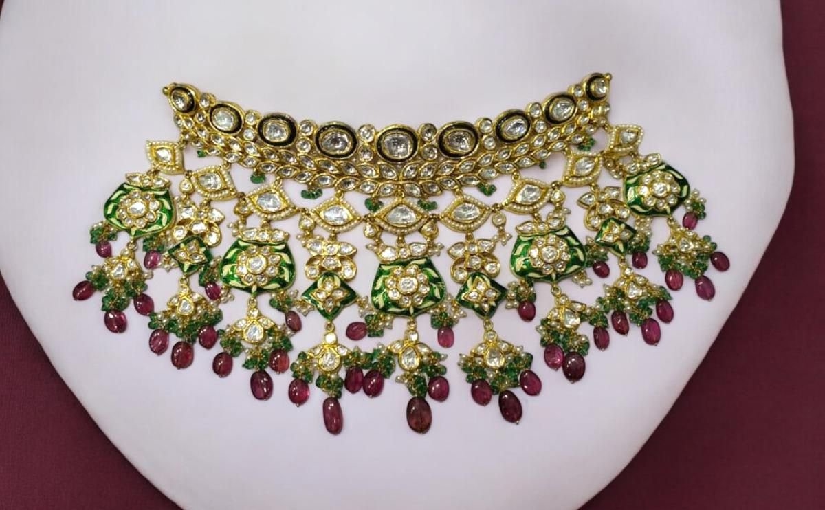 Detailed meena work on reverse side of kundan jewelry